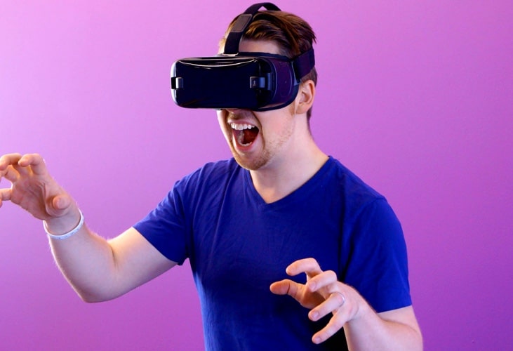 Person with VR headset playing